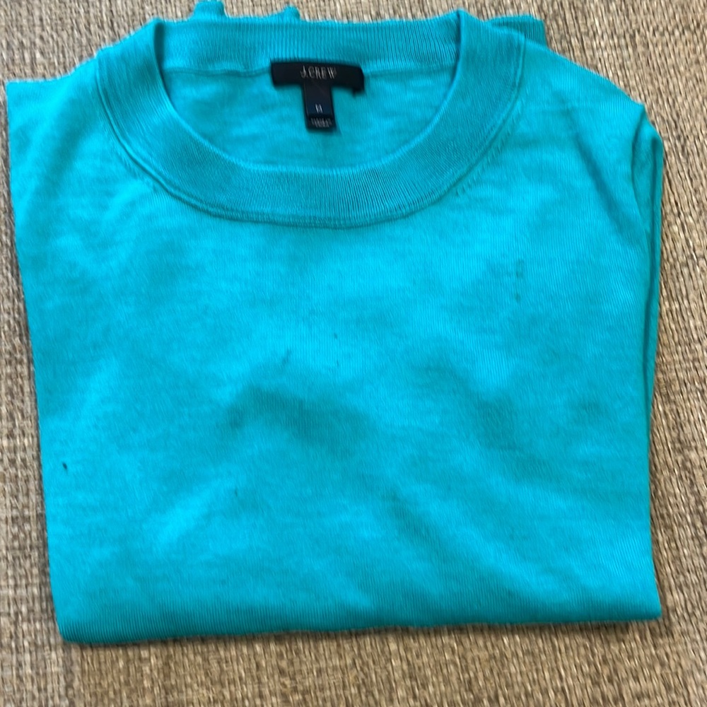 Woman’s crew neck sweater.